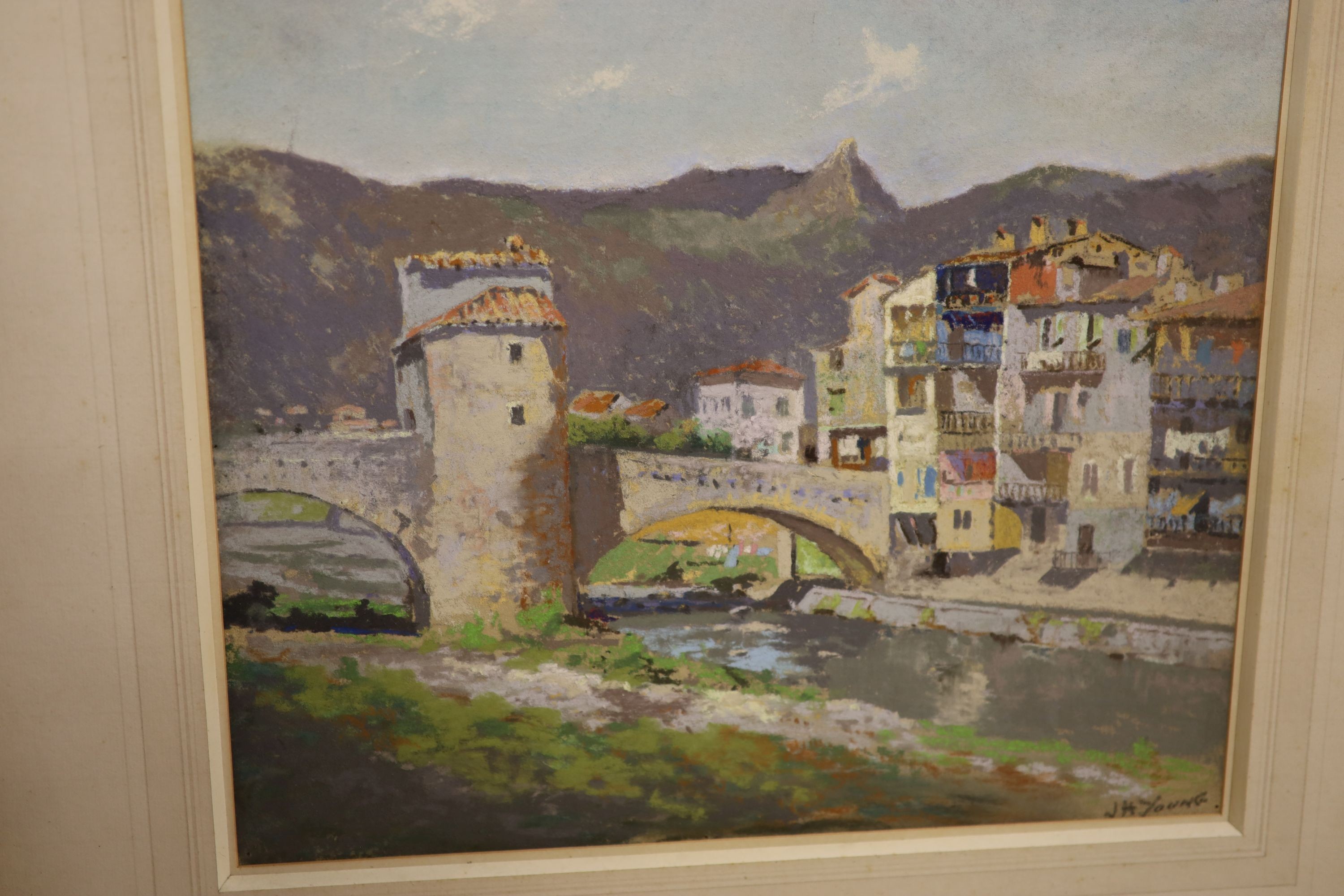 J.H. Young, pastel, View of an Italian town, signed, 34 x 39cm, together with seven other assorted works by the same hand